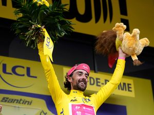 Ben Healy celebrates in yellow