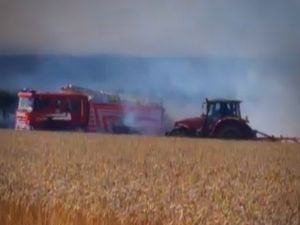 Supporting image for story: Footage appears to show firefighters and tractor driver battling High Ercall field blaze together