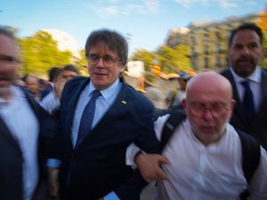 Supporting image for story: Ex-Catalan leader evades Spanish police on return after seven years as fugitive