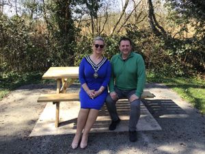 Llandrindod Wells Mayor Councillor Marcia Morgan and Steve Gealy, Powys County Council’s Countryside and Outdoor Recreation Officer making the most of the new picnic benches