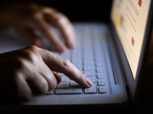 Hands on a laptop