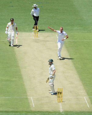 England's Stuart Broad (right) celebrates taking the wicket of Australia's Chris Rogers (bottom)