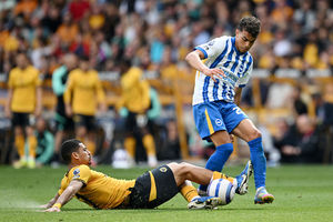 Yasin Ayari of Brighton & Hove Albion is challenged by Andre (Photo by Gareth Copley/Getty Images)