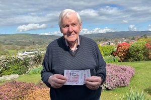 Gareth Davies with prize tickets for the Voices of Wales Women in Focus