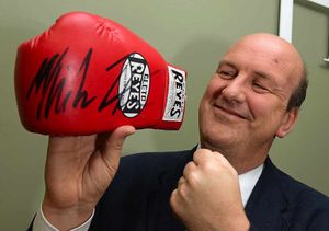 Jeremy Lamond from Halls Auctioneers with the MikeTyson-signed glove