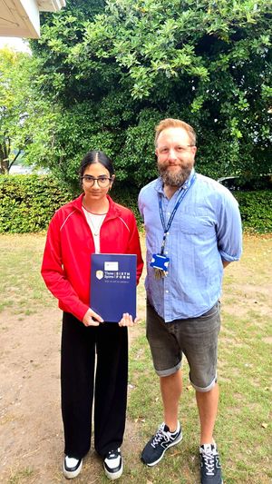 Top achiever, Jasdeep K., smiling with her results alongside Tettenhall Campus's Vice Principal Chris Green.