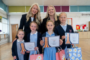 Bellway Sales Advisor Olivia Ingles (left) and Sales Manager Rachel Marner with pupils from Baldwins Gate CE (VC) Primary School who took part in Bellway’s interior design competition. From left: Ella, Phoebe, Violet and Indie.