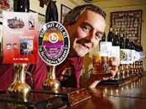 Supporting image for story: John rolls out barrels for ale event