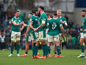 Caelan Doris and Ireland's players look down at full-time