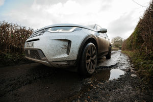 A car rattles over a Shropshire pothole