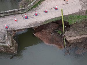 Supporting image for story: Midlands Medieval bridge collapses into river after floods damage