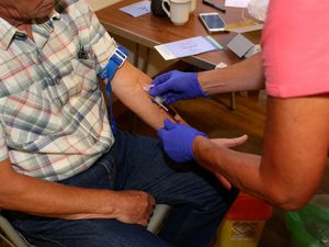 A man having a blood sample taken from his arm