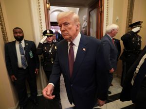 President Donald Trump leaves the chamber after addressing a joint session of Congress