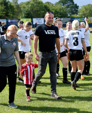 Owen Jones and son Harry on the pitch