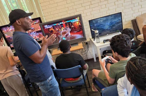Daniel Squires leads the young people in summer activities