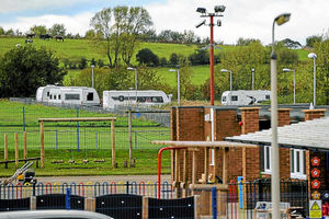 Travellers have set up camp on a car park belonging to a school, causing chaos