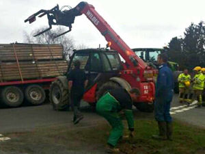 Supporting image for story: Dangling farm trailer causes road and rail delays