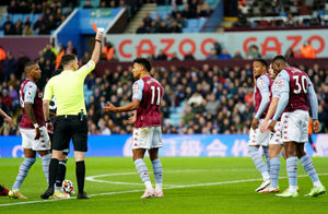 Aston Villa's Ezri Konsa (right, in background) is showed a red card