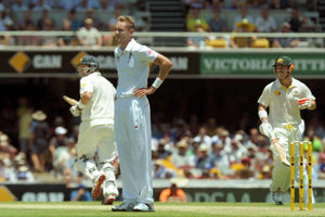England's Stuart Broad looks-on as Australia's Shane Watson (left) and David Warner (right) put runs on the board