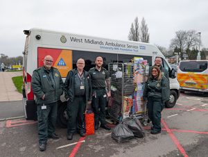 Ambulance staff with presents for children
