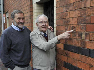 Supporting image for story: Bullet holes at toilet block tell war story
