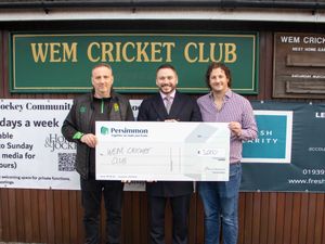 Persimmon Homes West Midlands Managing Director Joe Turner and local ward Councillor Alan Holford present a cheque to Wem Cricket Club Chairman Shaun Astley