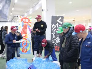 Buyers inspecting whale meat in Japan