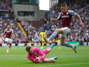Crystal Palace goalkeeper Jack Butland saves from Aston Villa's Lucas Digne during the Premier League match at Villa Park, Birmingham. Picture date: Sunday May 15, 2022. PA Photo. See PA story SOCCER Villa. Photo credit should read: Zac Goodwin/PA Wire...RESTRICTIONS: EDITORIAL USE ONLY No use with unauthorised audio, video, data, fixture lists, club/league logos or "live" services. Online in-match use limited to 120 images, no video emulation. No use in betting, games or single club/league/player publications..