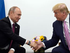 US President Donald Trump, right, shakes hands with Russian President Vladimir Putin, left, during a bilateral meeting on the sidelines of the G-20 summit in Osaka, Japan in 2019