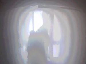 Firefighters work to rescue the woman as the hallway filled with smoke from the blaze