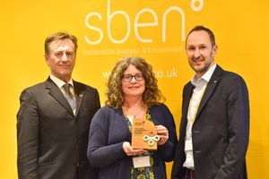 Vikki Brooks (centre) is presented with her Contribution to sben Award by Martin Murray, Staffordshire County Council’s Deputy Leader and Cabinet Member for Economy and Skills (left) and sben Chair Adam Whitehouse (right).