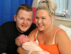 Romi-Ann with her parents Connor and Paige