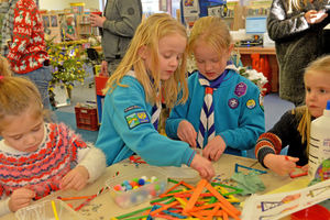 Children making Christmas decorations at Market Drayton Library Christmas Party