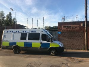 A police van outside Timmins Waste, in Wolverhampton, following the incident