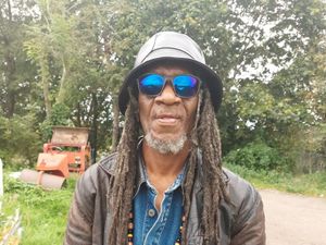 Hubert Brown wearing sunglasses and a sunhat