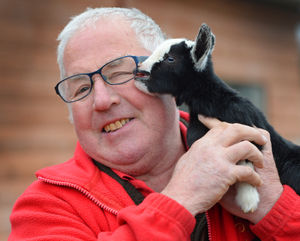 Tony Scott, from Scotty's Donkey and Animal Park, Norton, with a new born baby pygmy goat. He believes it is the smallest one they have ever seen as it stands at only seven inches tall