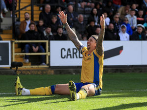 Walsall signing Aden Flint celebrates scoring for Mansfield Town. (Image by PA)