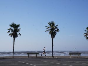 A jogger runs along the sea front in Southend-on-Sea, Essex