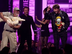 Supporting image for story: Jackass star joined onstage by enormous white snake at MTV Movie and TV awards