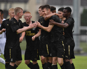 Walsall defender Oisin McEntee celebrates scoring for Newcastle United under-18s. (Image by Charles McQuillan/Getty)