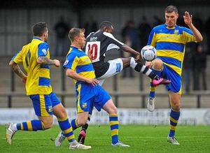 Ahmed Obeng lifts his leg the highest to volley