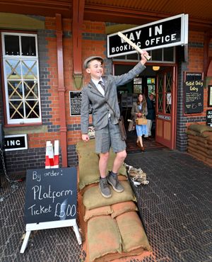 This young man was selling newspapers at the station