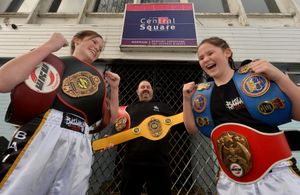 Rising kickboxing stars, Lilimae Marson, 14, and Molli Marson 12, at Central Square Nightclub which is the base for JL Security who have sponsored the girls. Pictured with them is Paul Lucas