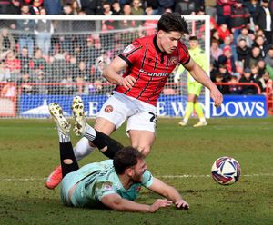 Jamie Jellis battles for the ball.