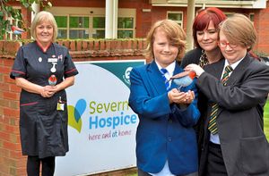 Matron Helen Duce presented Becki Haywood and her sons Pip and Oskar with one of the brand new robins 