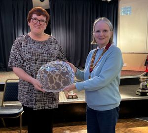 Cup that cheers – Louise Cotton accepts the County Women’s Cup from Pauline Wilson