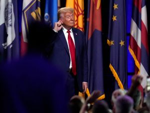 Supporting image for story: Trump responds to new indictment by sharing social media posts with QAnon links