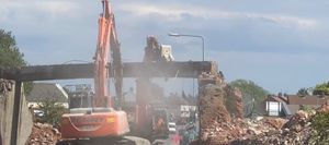 The bridge being ripped down