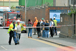 Workers outside Sims Metal Management