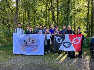The Dudley team preparing to start the Ben Nevis climb. Dudley historian Rose Cook-Monk holds a tribute to past climbers Ben Corfield and Richard Body. To her left are Councillors Simon Phipps, Chris Barnett and organiser Alderman Steve Waltho with Shaz Saleem to her right holding the Saleem Foundation banner.